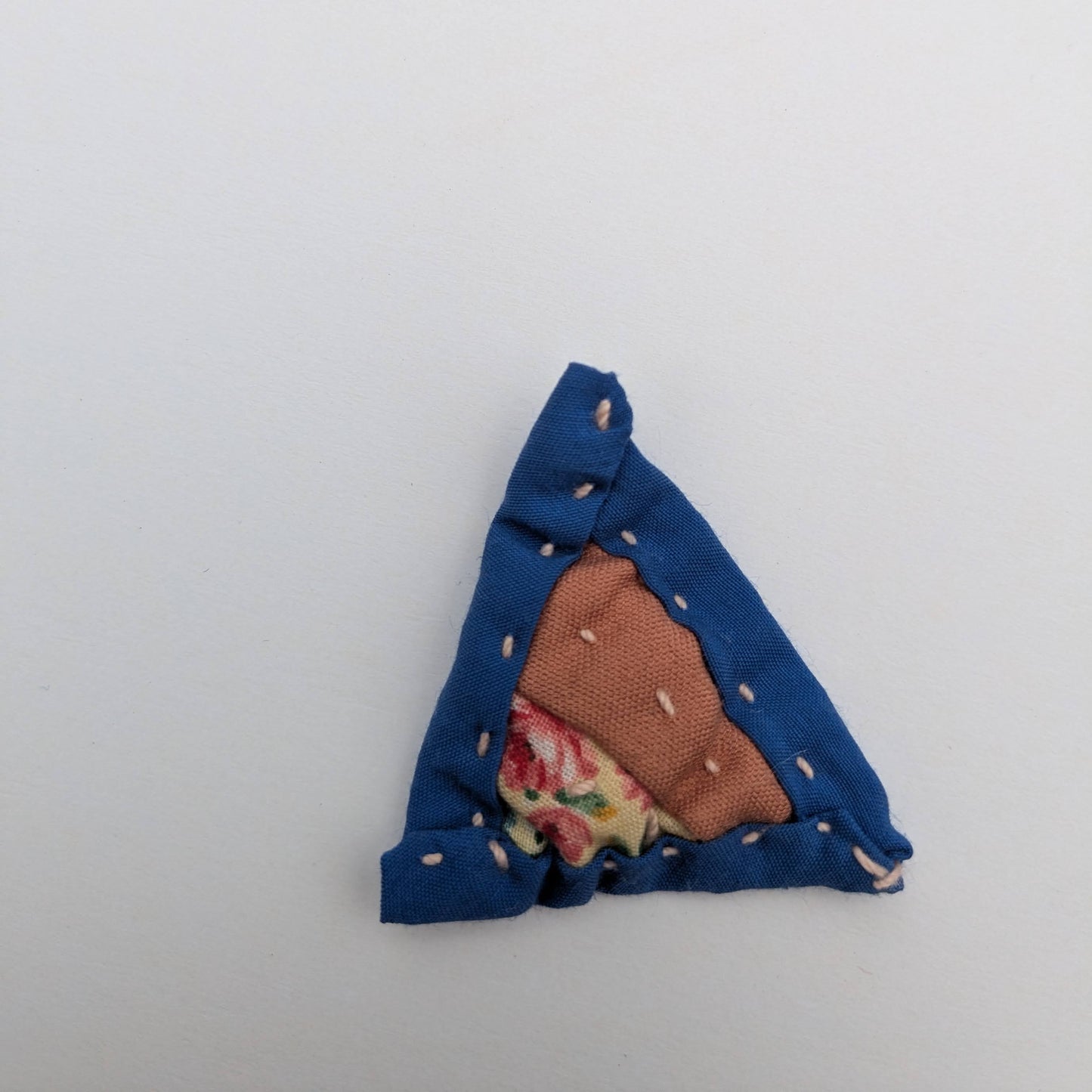 Triangle patchwork magnet with pink and blue