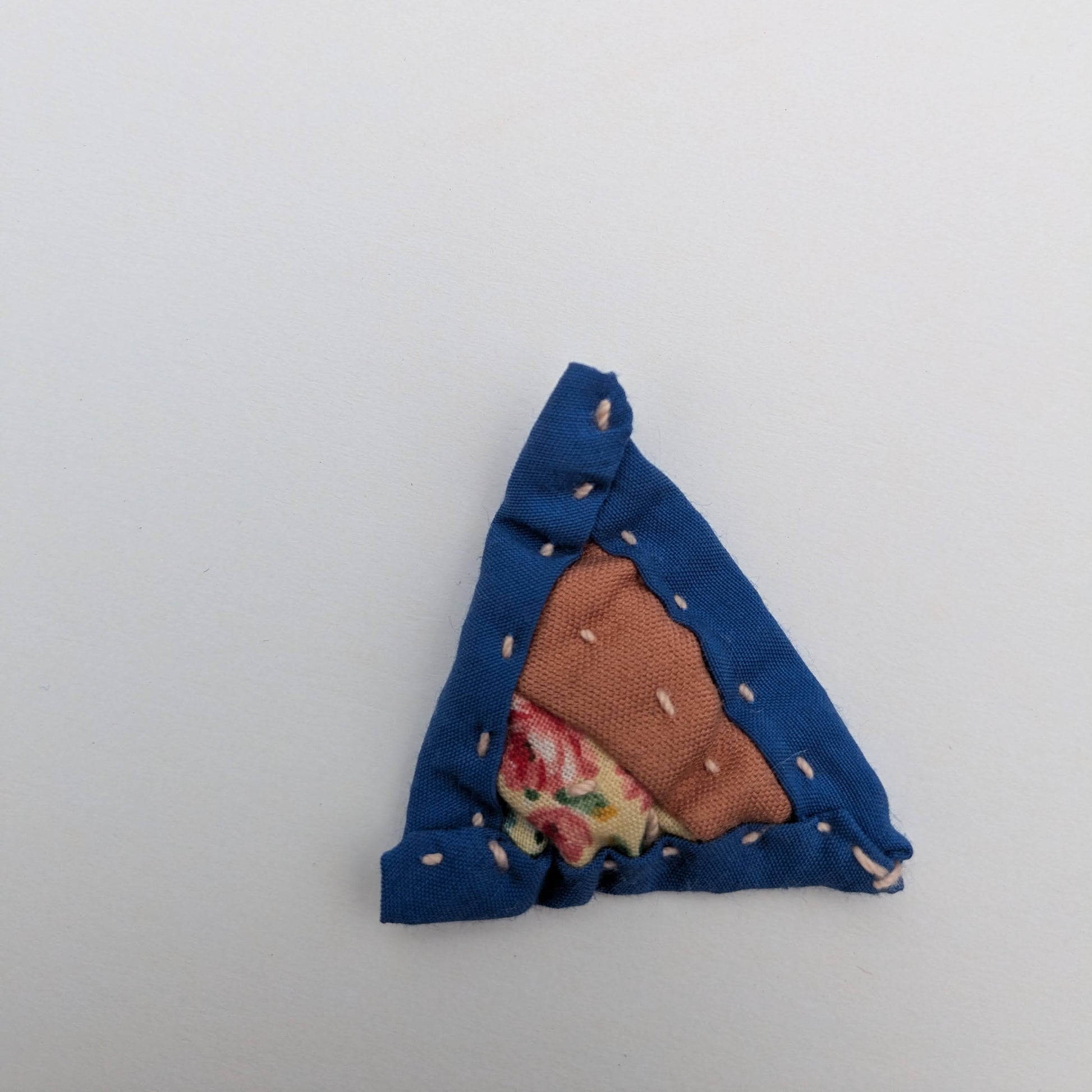 Triangle patchwork magnet with pink and blue